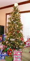 Christmas tree, presiding over a lot of gifts